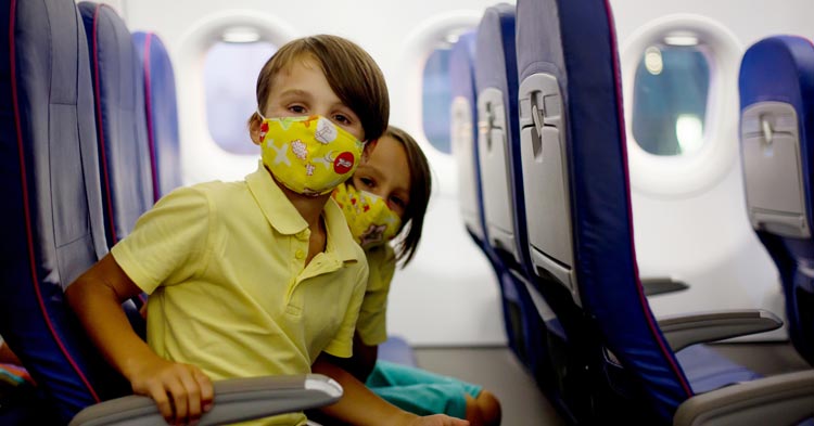 children travelling in a plane during covid whose parents are divorced who share custody