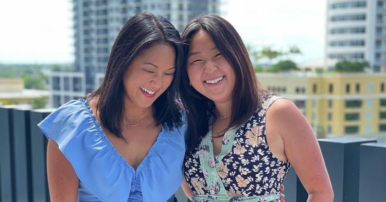High Swartz Law Firm Administrator Emily Bushnell hugs her long-lost twin sister Molly Sinert after meeting on their 36th birthday in Florida