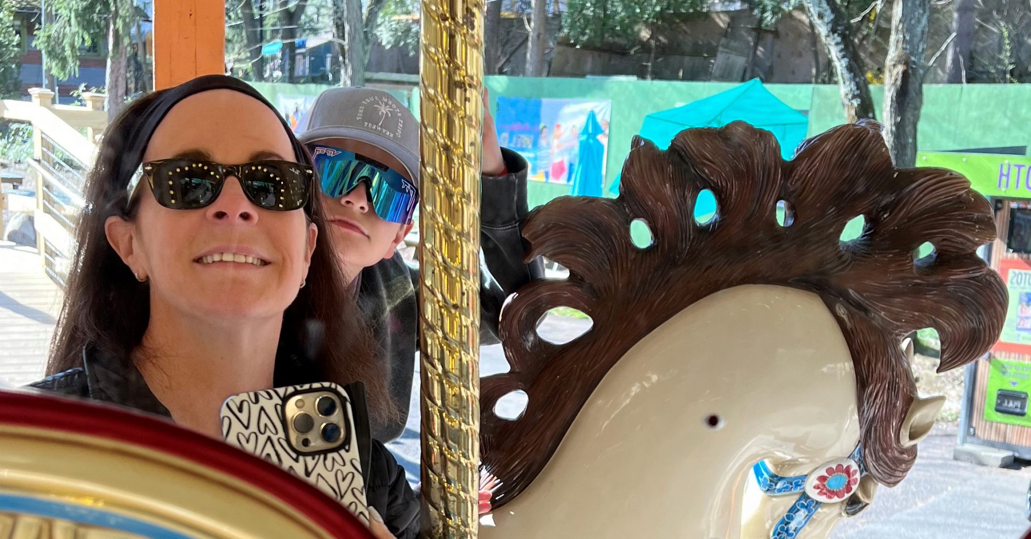 High Swartz LLP Attorney Missy Boyd and her son, Sean enjoying the carousel during Family Day at Elmwood Park Zoo, hosted by MCAP.