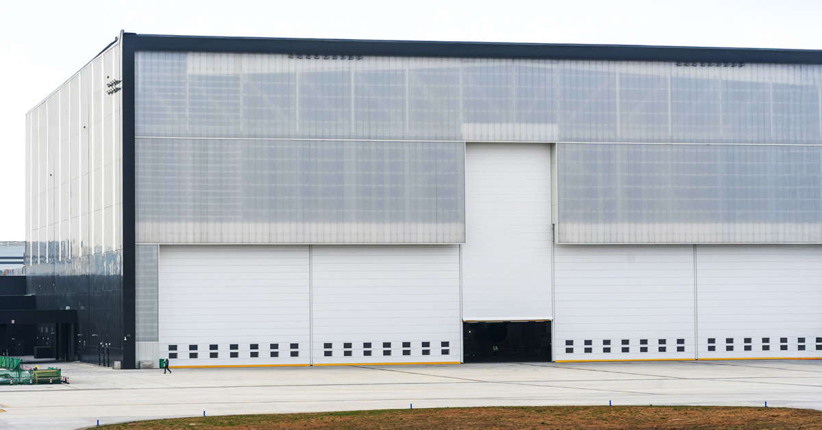 large warehouse building with garage door opening